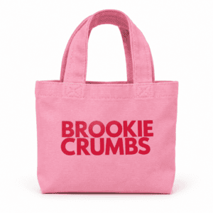 Pink Brookie Crumbs mini tote bag with a red velvet cookie